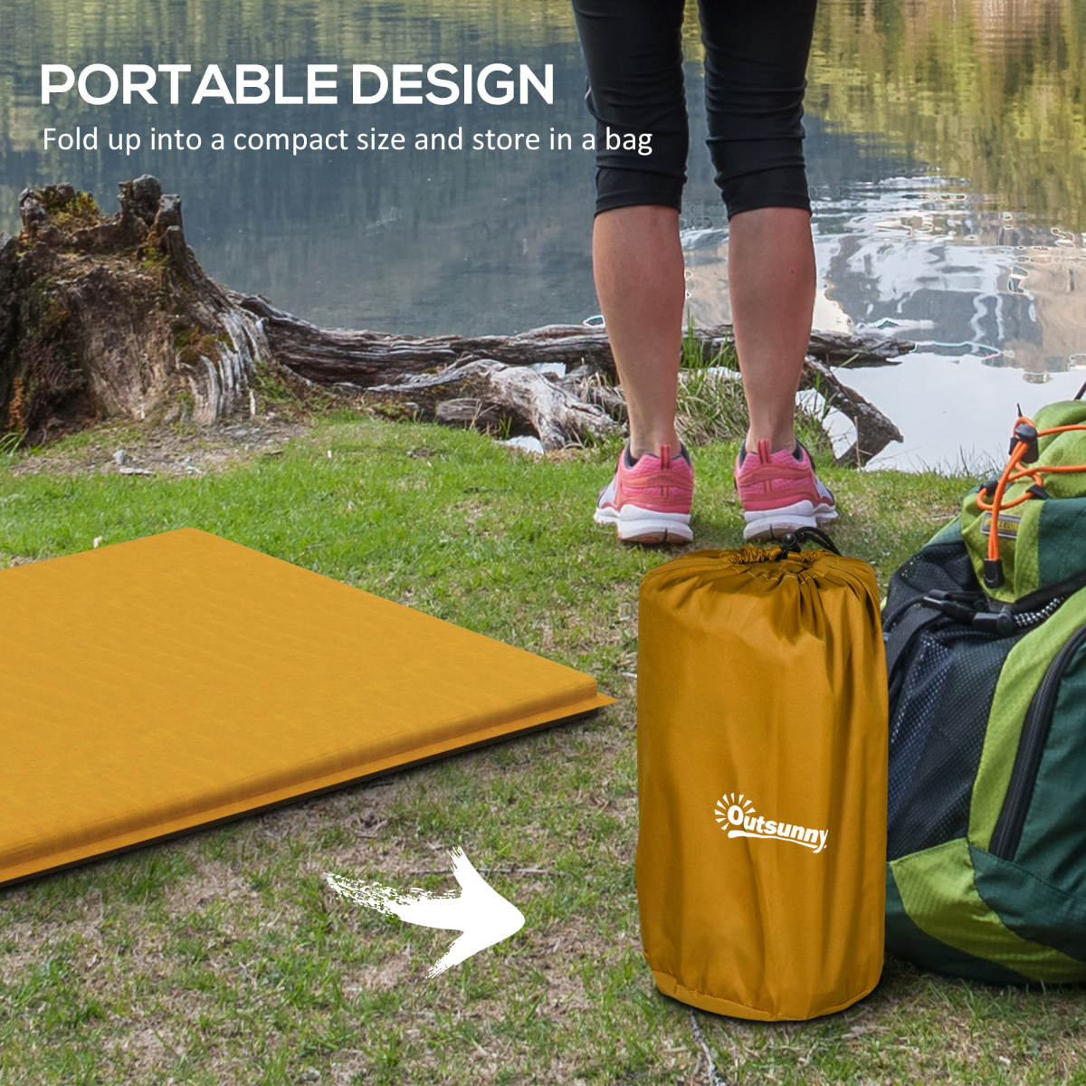 Portable camping mat, folds compact for van life & outdoor adventures, shown with storage bag near lake