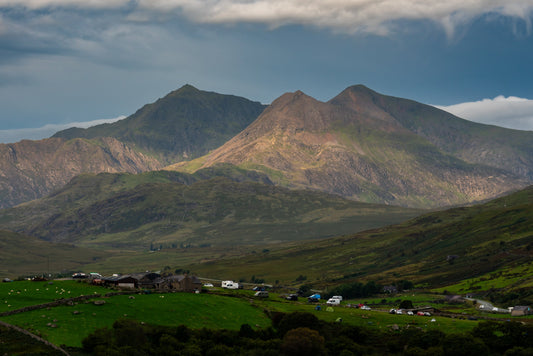 Campervans beneath the mountains of Eryri in Wales