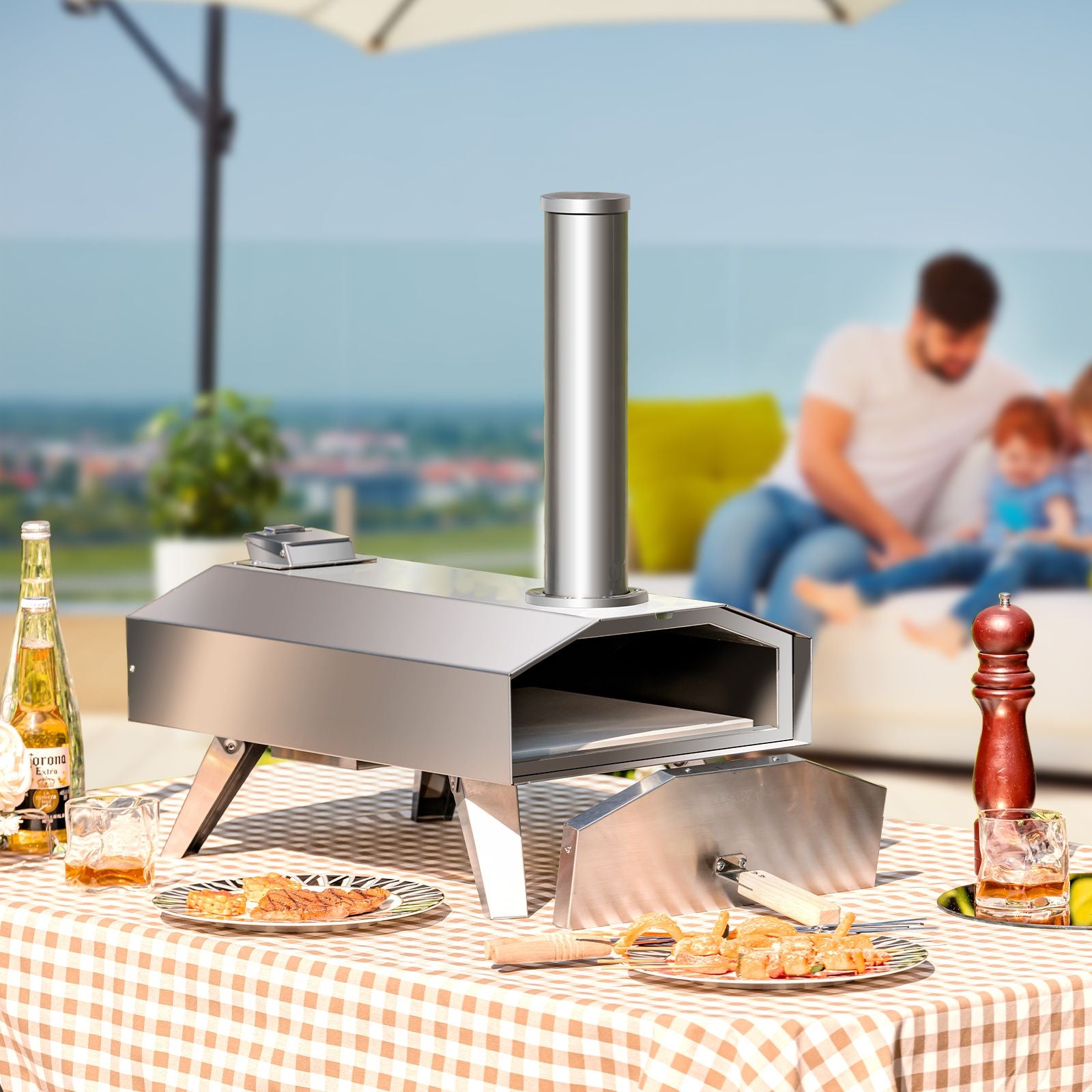 Portable outdoor pizza oven on picnic table, perfect for van life and camping adventures with family.
