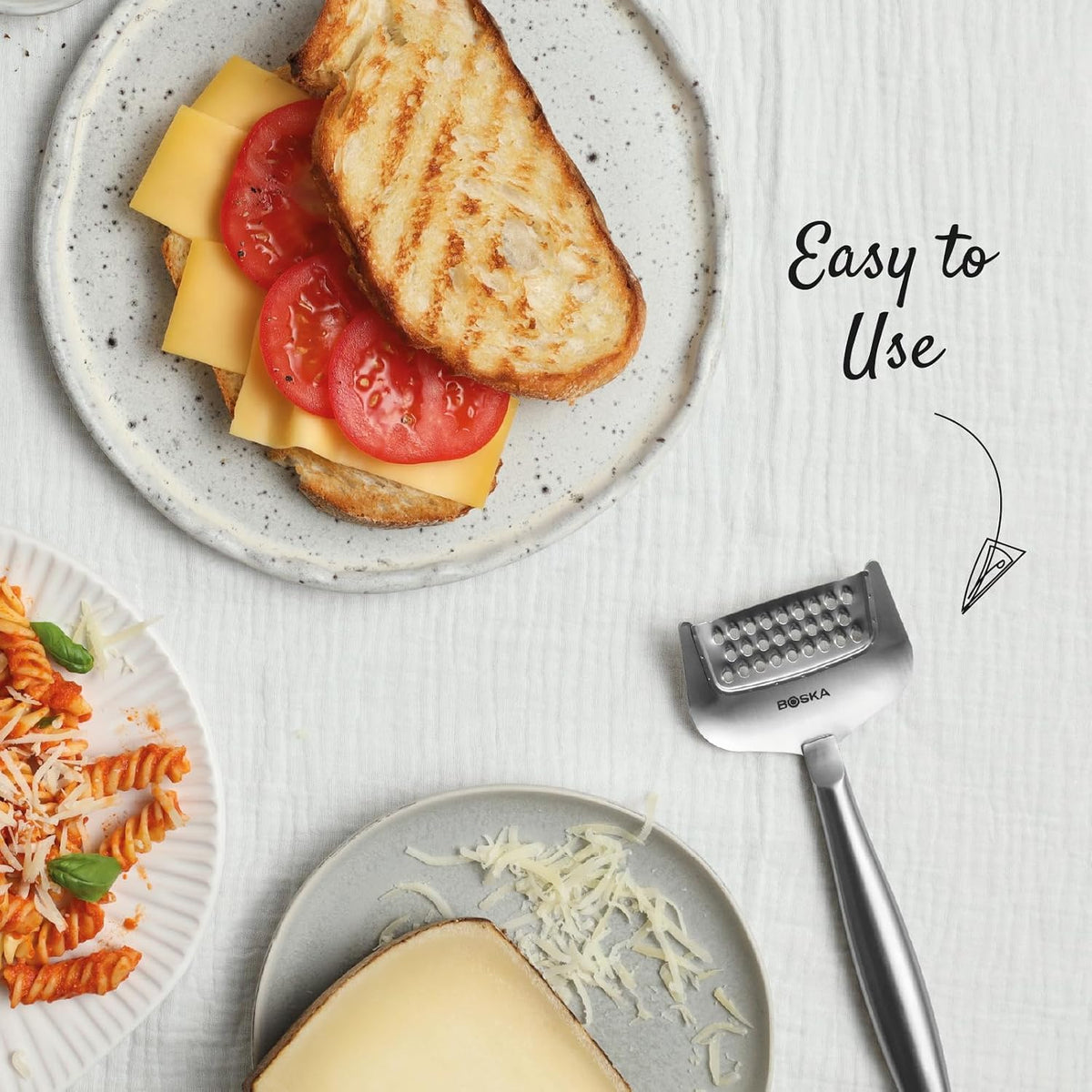 BOSKA Copenhagen Handheld Cheese Grater – grater beside cheese and toast