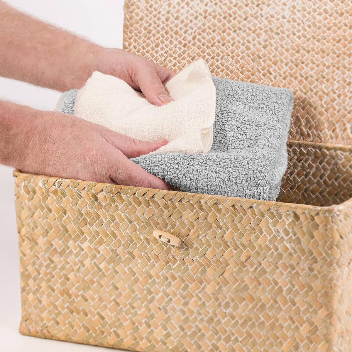 Lidded Seagrass Storage Boxes – Set of 3 – open box holding towels