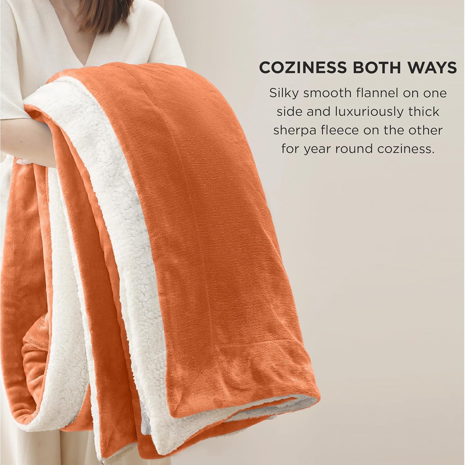 Cozy orange and white reversible blanket, perfect for van life comfort and outdoor adventures.