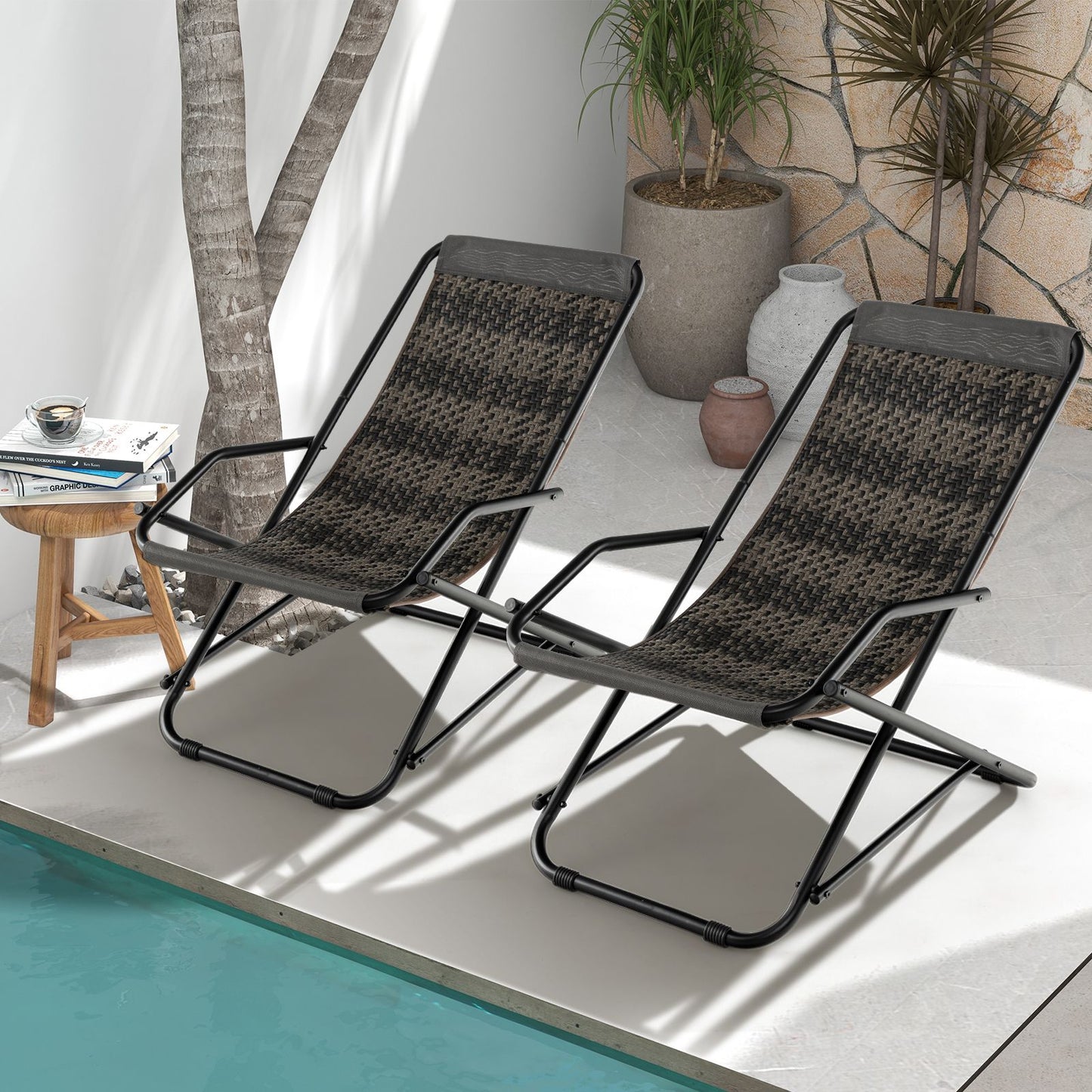 Two foldable outdoor lounge chairs by poolside, perfect for van life or patio relaxation