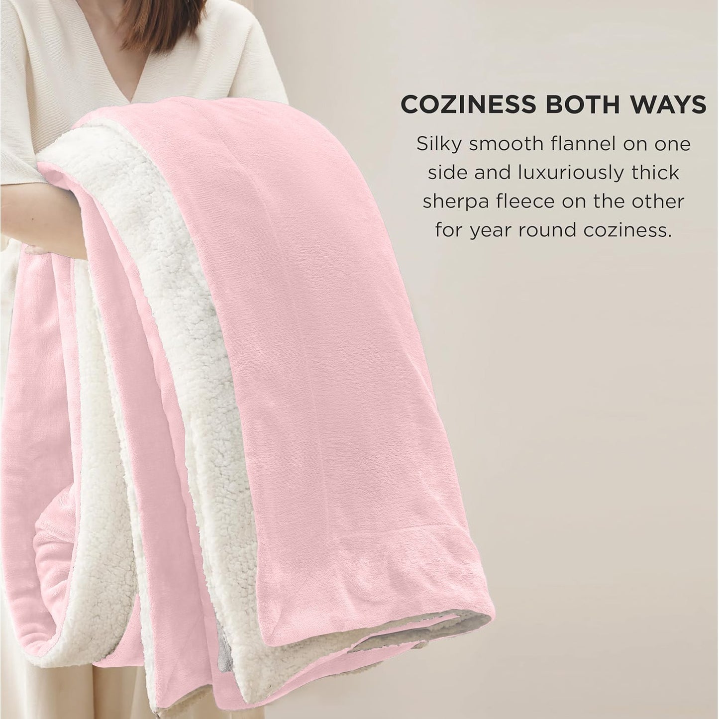 Pink and white reversible sherpa fleece blanket for van life coziness