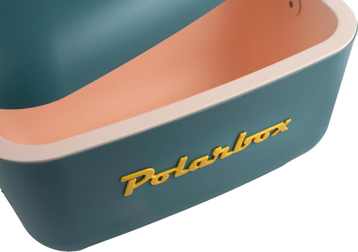 Close-up of a teal and peach rectangular storage container with rounded edges and yellow raised lettering reading 'Polarbox'.