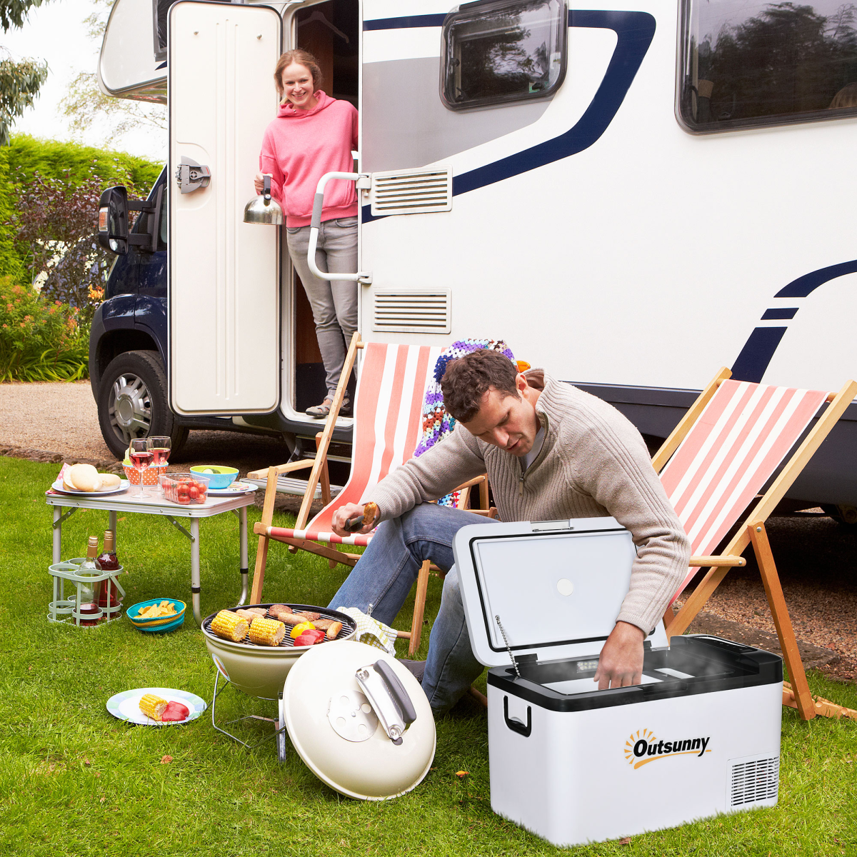 Outsunny portable fridge for van life camping with couple grilling outdoors