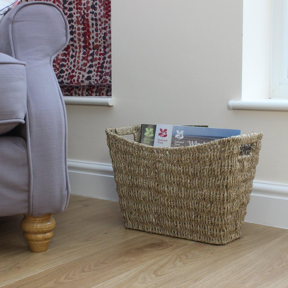 Seagrass Magazine and Book Rack – rack with magazines beside an armchair