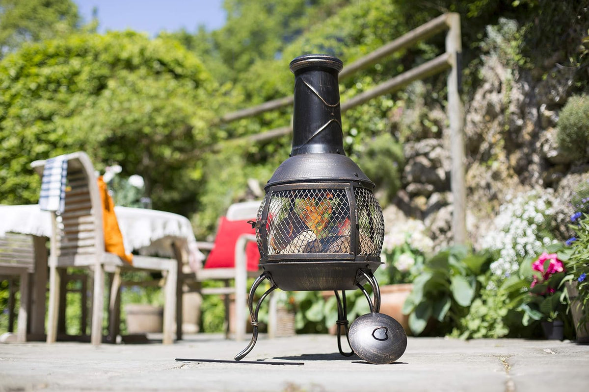 La Hacienda Leon Steel Chiminea – Bronze Effect – chiminea beside garden seating