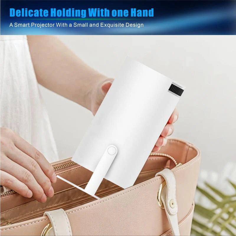 Compact smart projector held in hand, fitting easily into a tote bag for portable van life entertainment