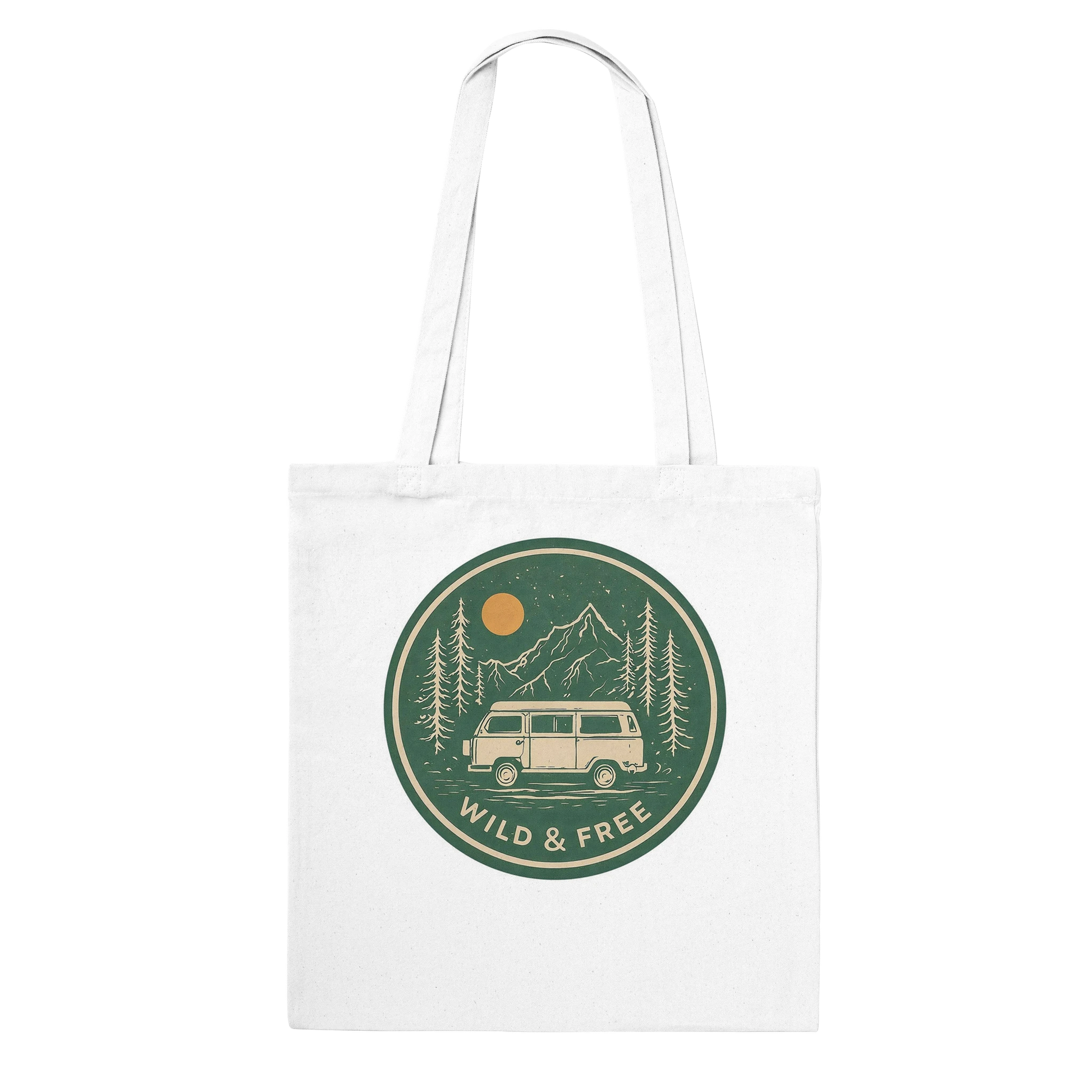 White canvas tote bag with 'Wild & Free' van life design, mountains, trees, and sunset graphic for outdoor adventures.
