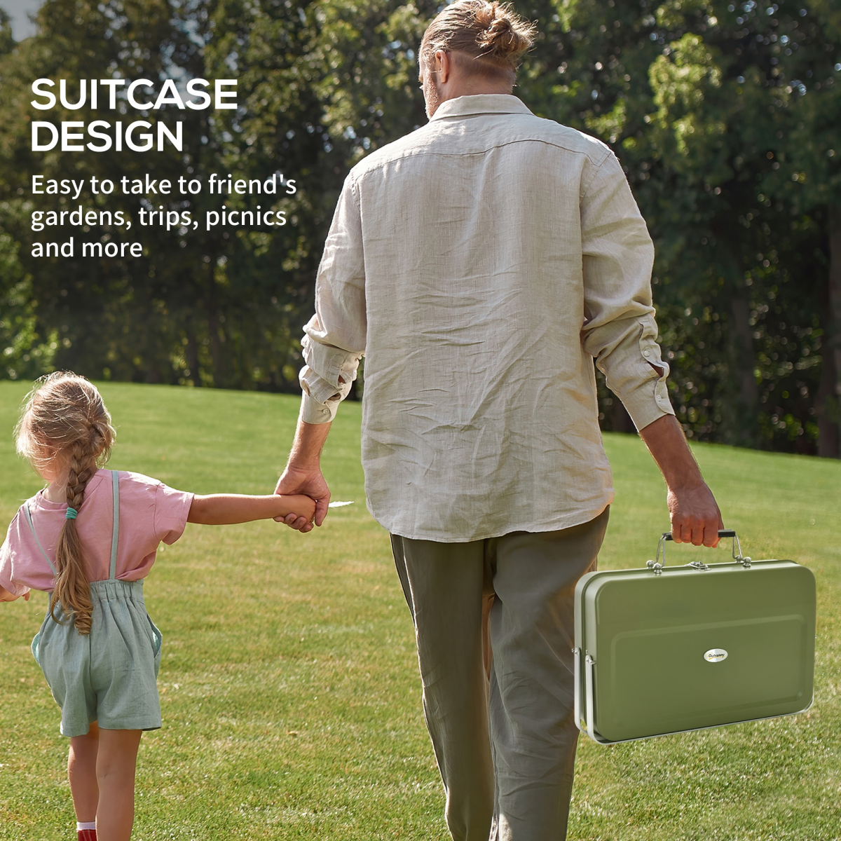 Man holding child's hand while carrying portable suitcase-style picnic set for trips and picnics