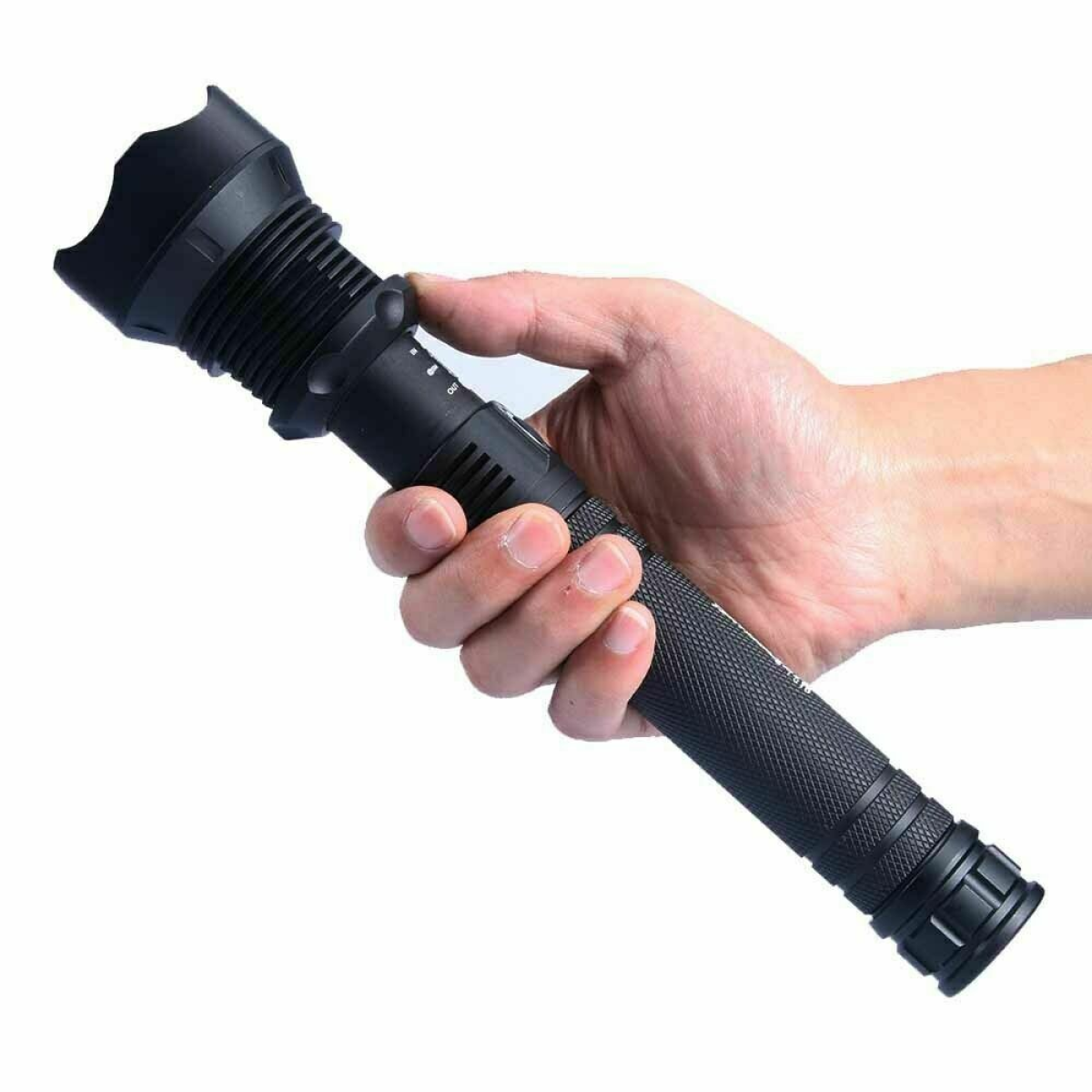 Hand holding black tactical flashlight for van life and outdoor adventures