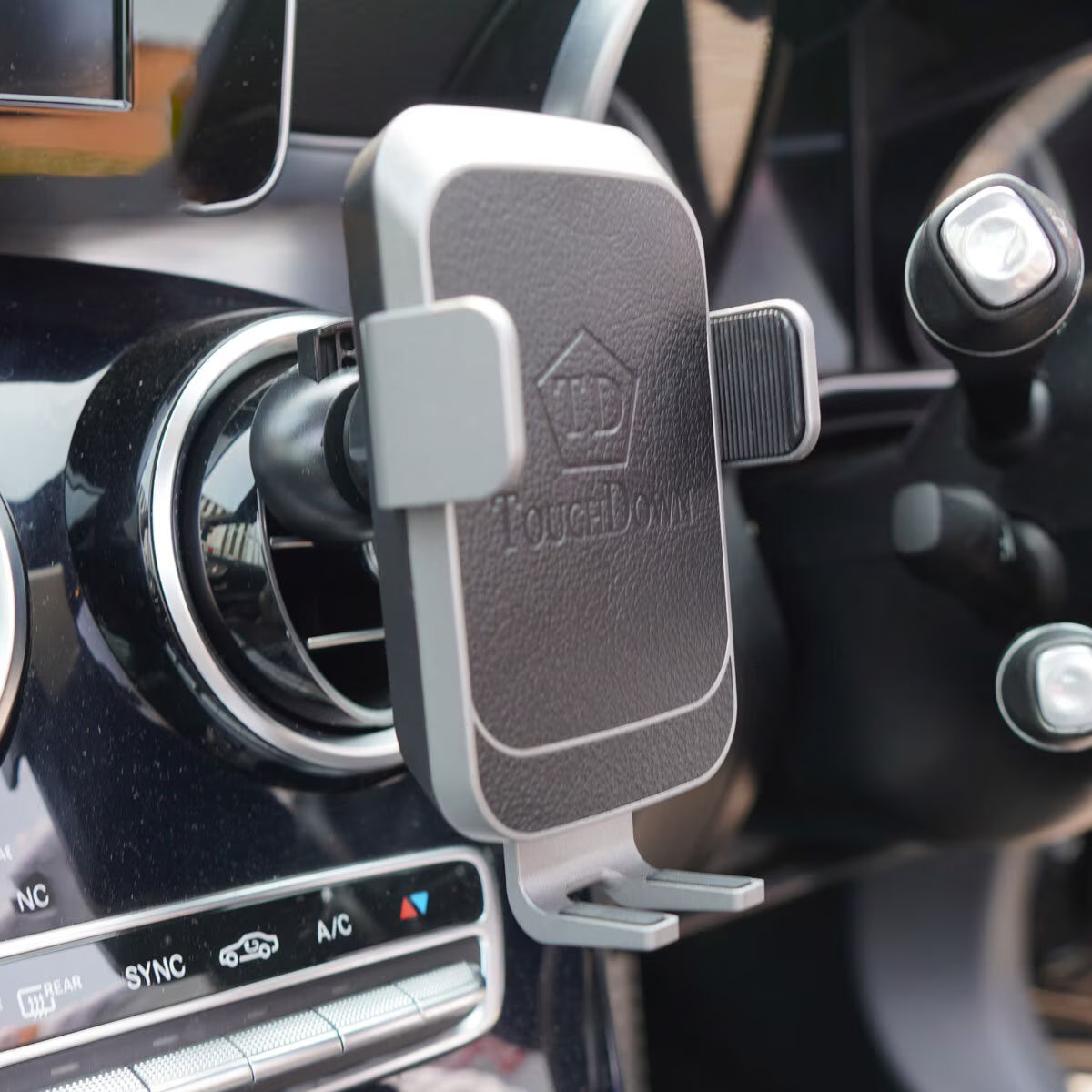 TouchDown car phone mount for van life, securely clips to air vent with adjustable grip