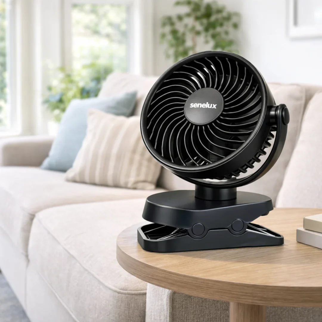 Senelux clip-on fan for van life, camping, or home cooling on wooden table near sofa