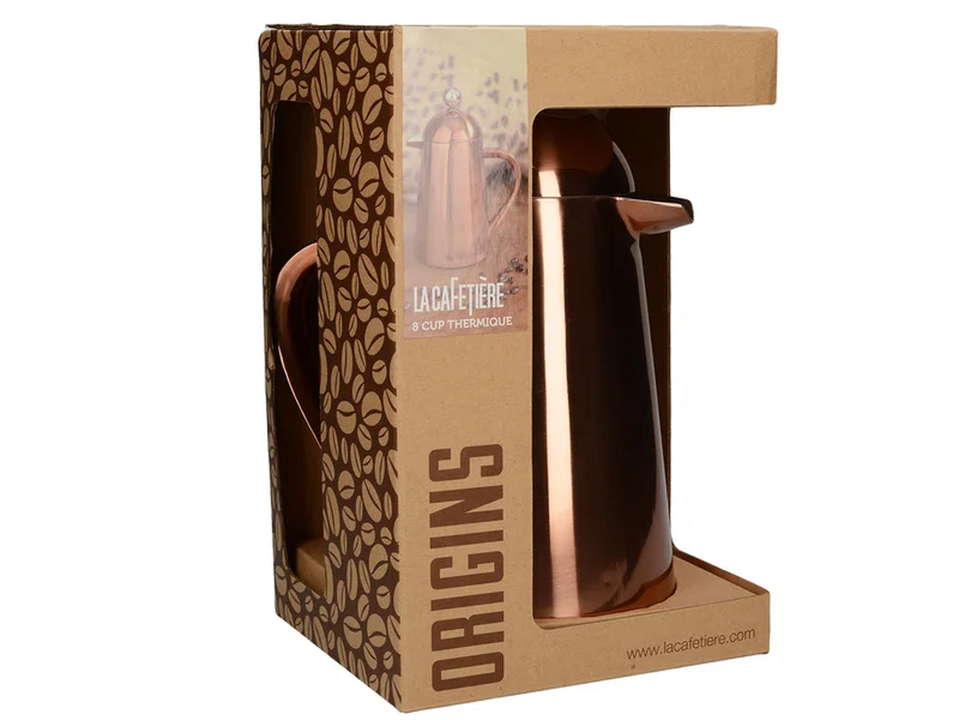 Copper thermal coffee carafe in Origins packaging, perfect for van life adventures and outdoor camping.
