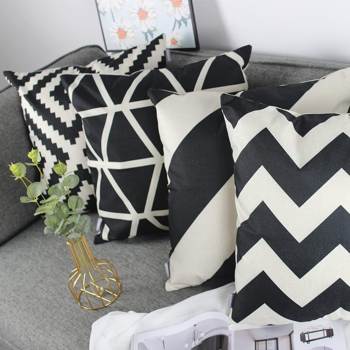 Black & Cream Geometric Cushion Covers – 4 Pack, 50cm – covers styled on a grey sofa