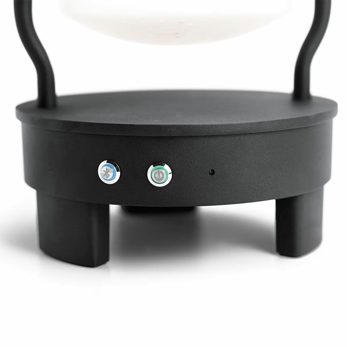 Black levitating speaker base with Bluetooth and power buttons for van life audio