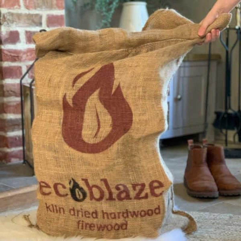 Kiln-Dried Birch Firewood Logs – 50L Hessian Sack – hessian sack being carried