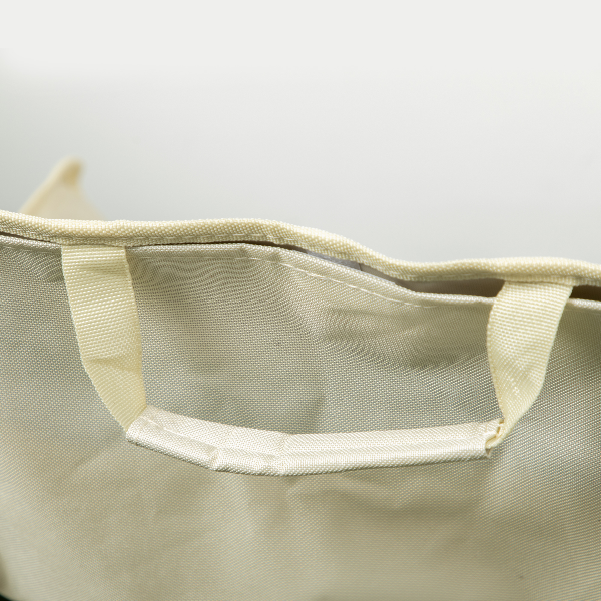 Cream canvas tote bag with sturdy handles, ideal for van life essentials and outdoor adventures.