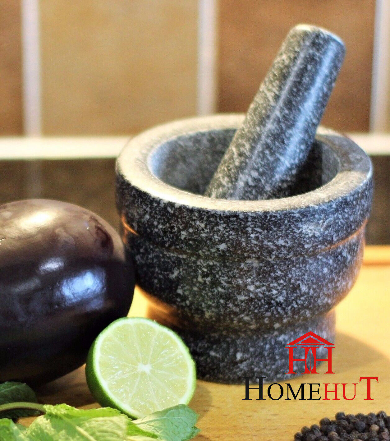 Granite mortar and pestle with lime, eggplant, mint for van life cooking essentials