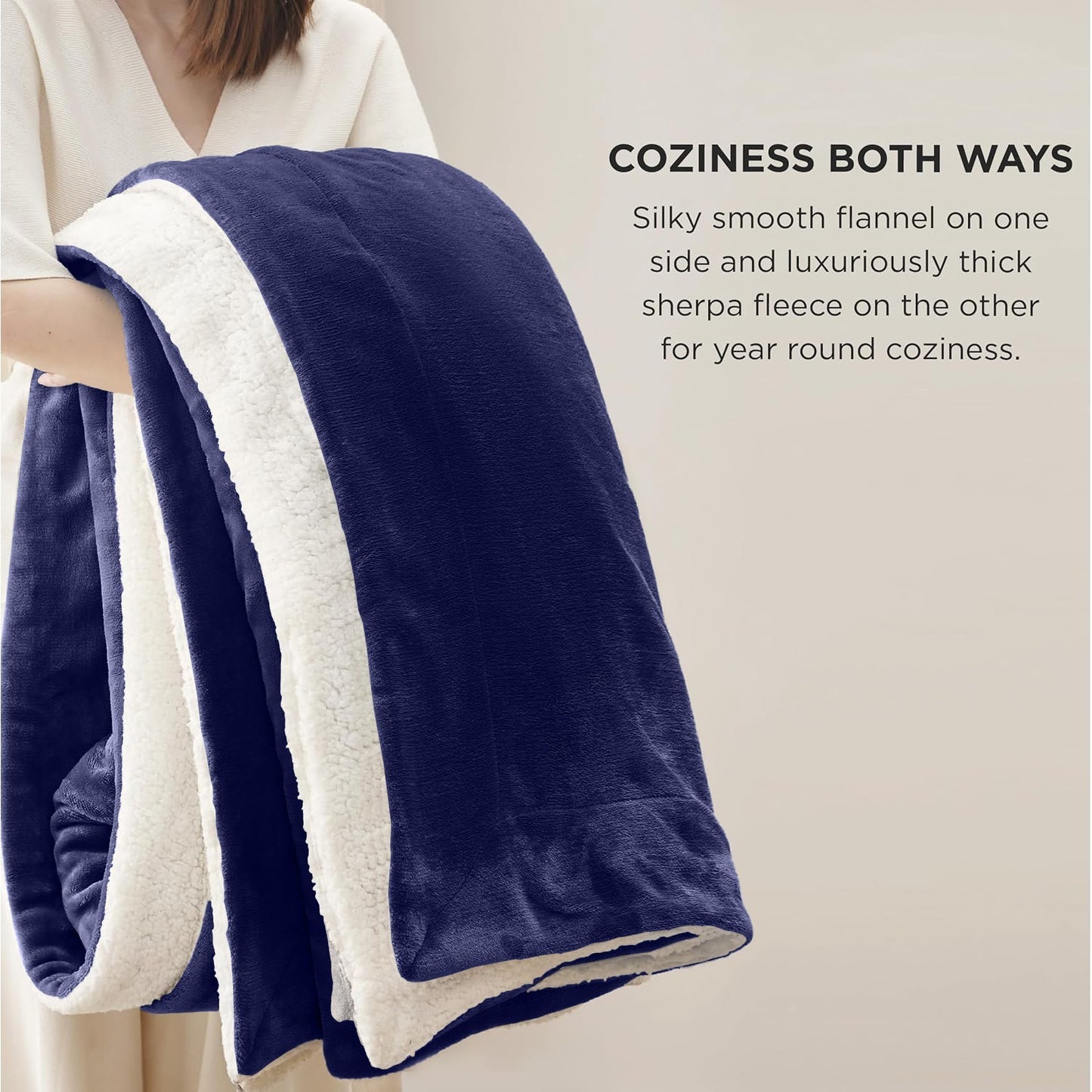 Cozy navy blue and cream reversible blanket with flannel and sherpa fleece for van life comfort
