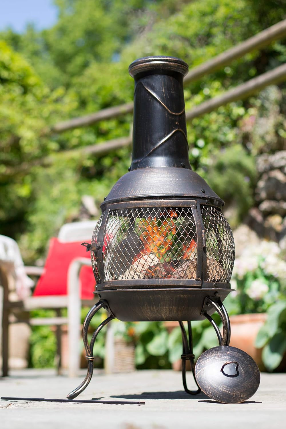 La Hacienda Leon Steel Chiminea – Bronze Effect – chiminea on a garden patio
