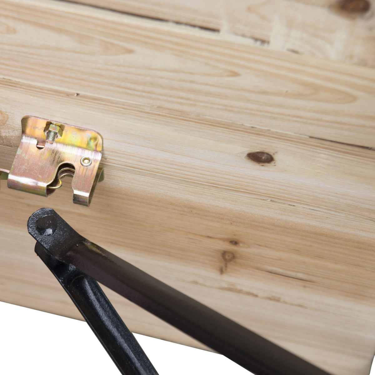 Wooden van bed with metal gas strut and latch, ideal for camper van conversions and van life setups.