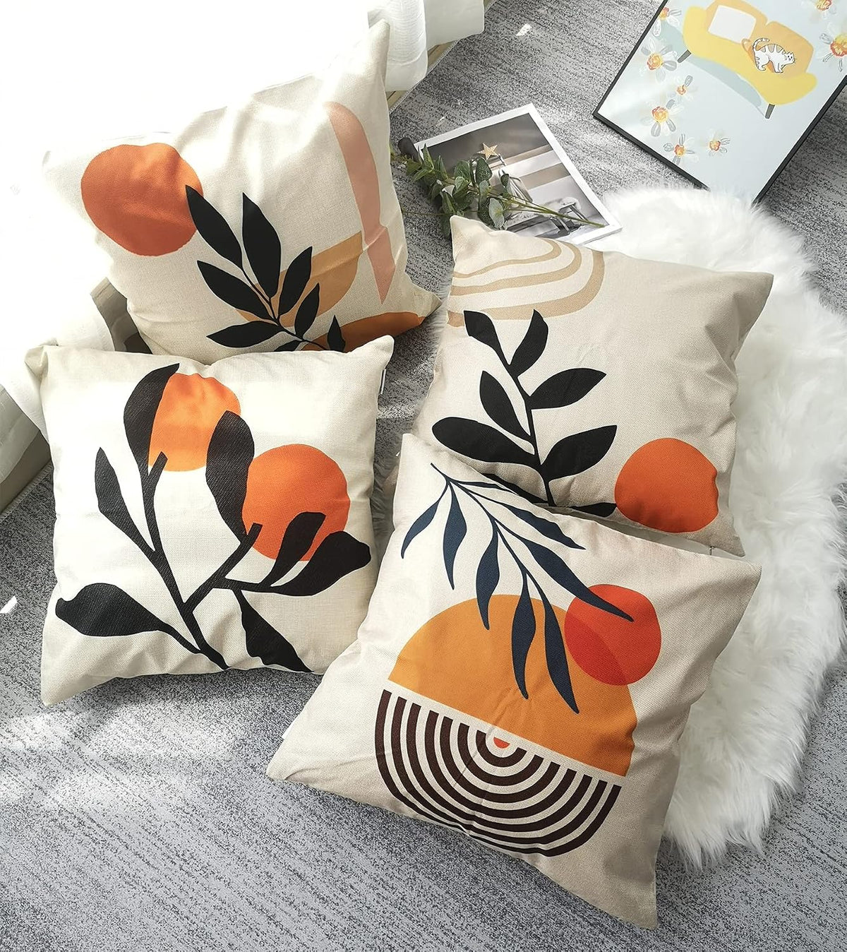 Orange Botanical Cushion Covers – 4 Pack, 50cm – four botanical cushions styled on a sofa