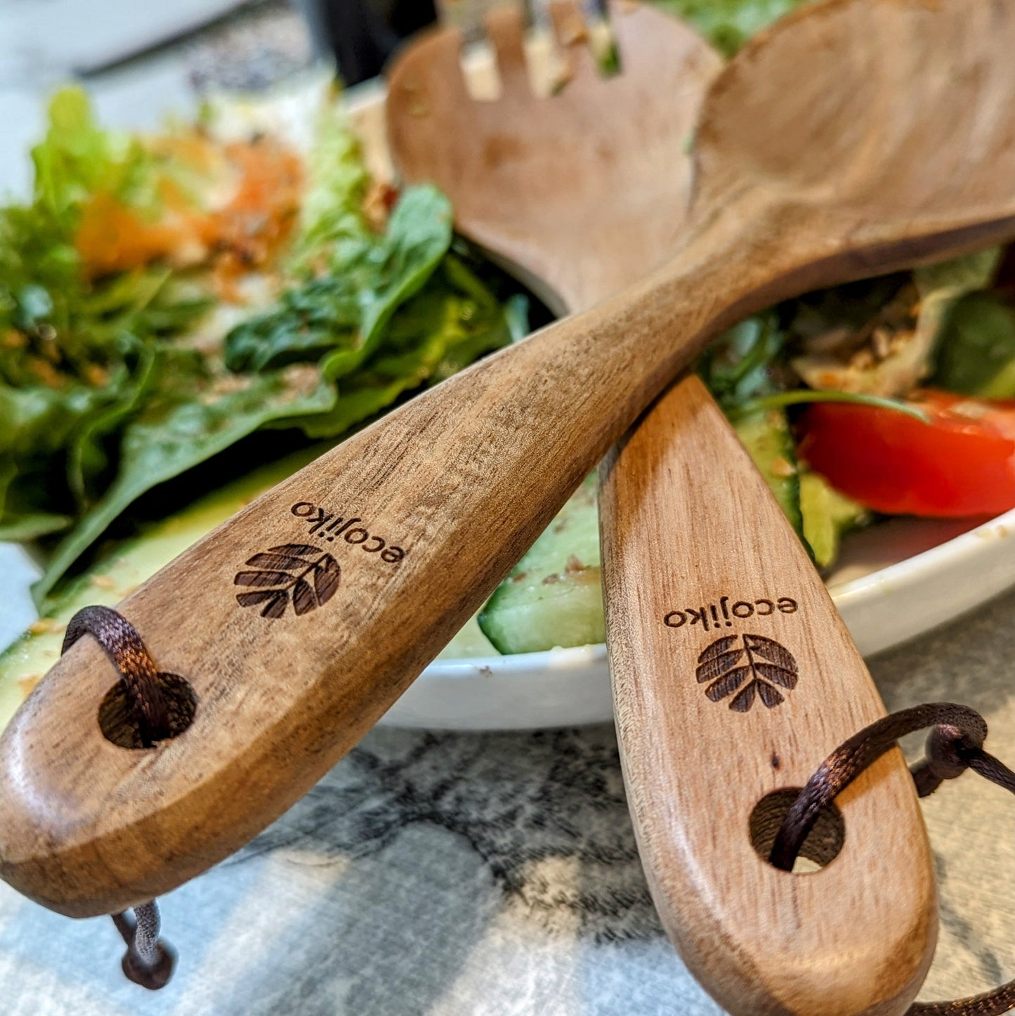 Eco-friendly wooden salad servers for van life, camping, and outdoor adventures with engraved ecojiko logo
