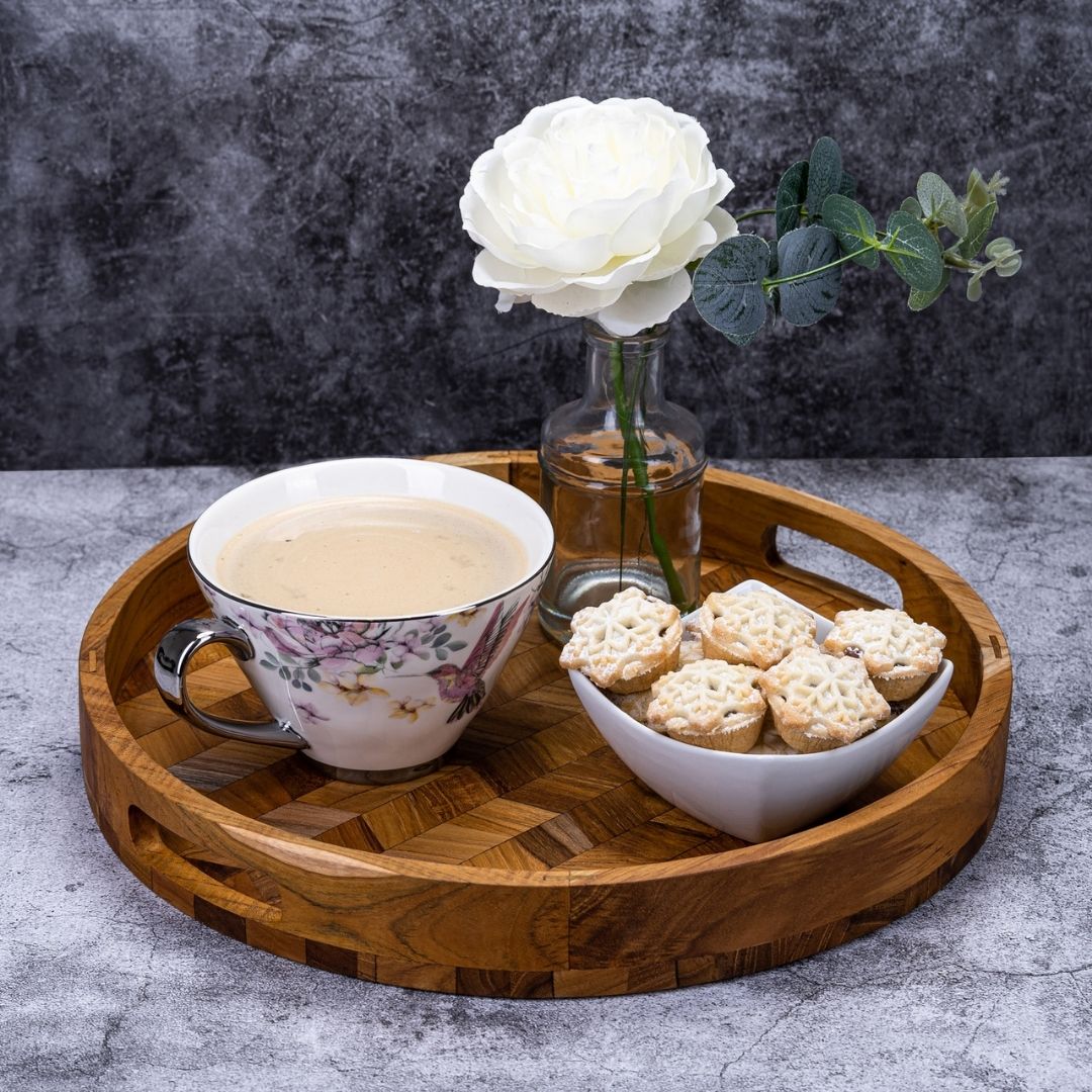 Wooden serving tray with floral teacup, mini pies, and white rose — perfect for van life or cozy adventures