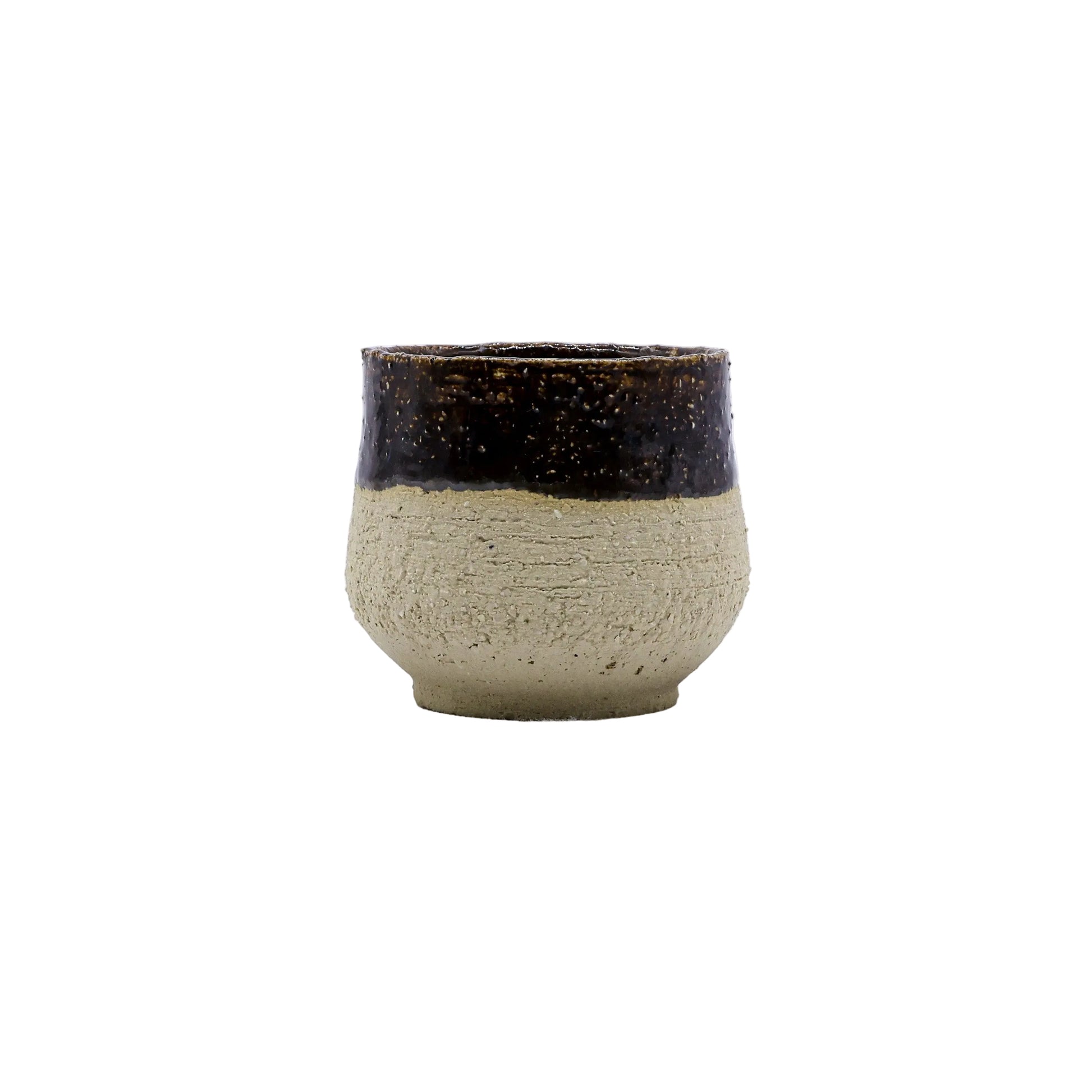 Handmade ceramic cup with rustic brown glaze, perfect for van life and outdoor adventures