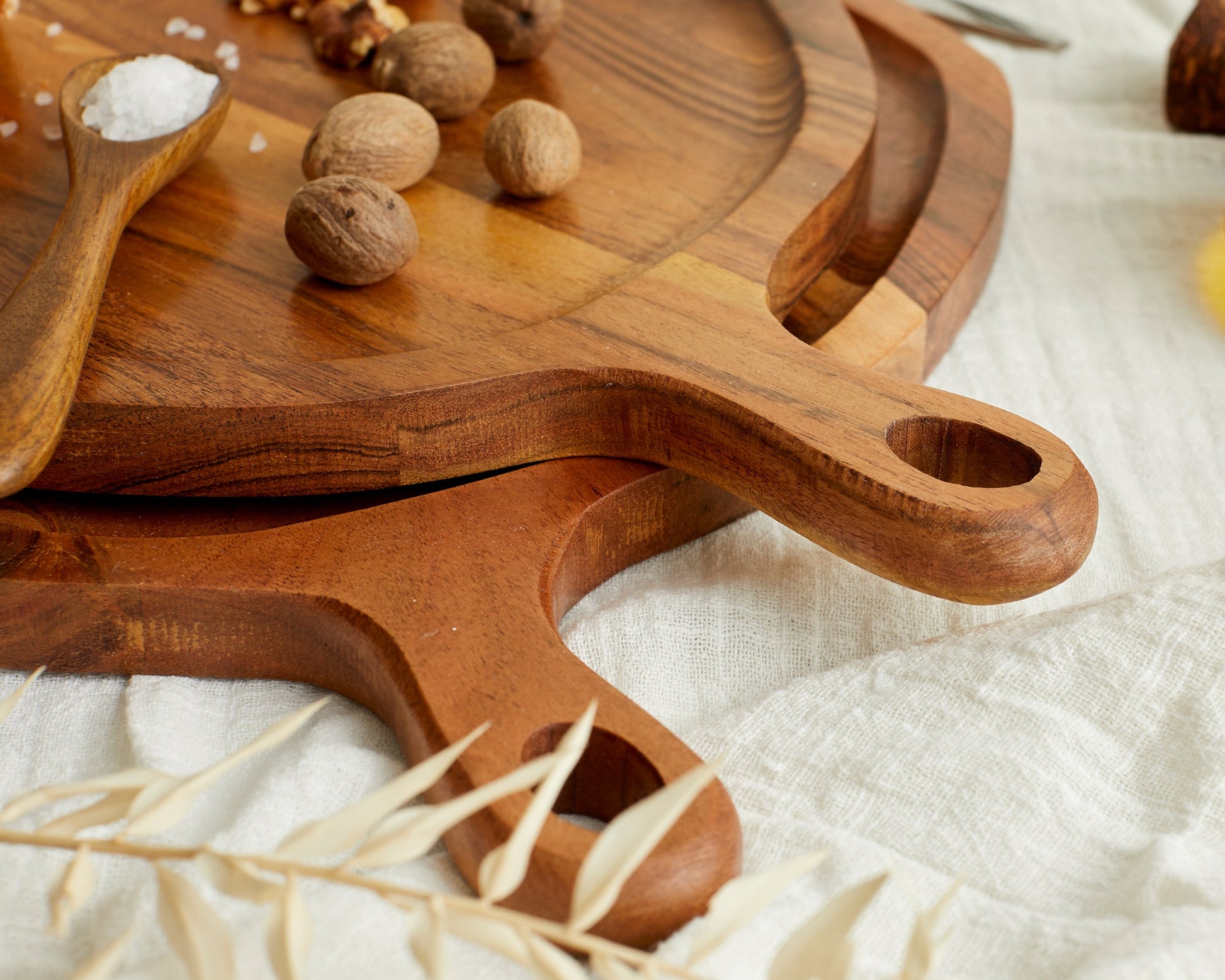 Solid wood cutting boards with handle, perfect for van life kitchen essentials and outdoor cooking gear.