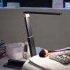 Compact LED desk lamp for van life, ideal for camper van interiors and outdoor adventures