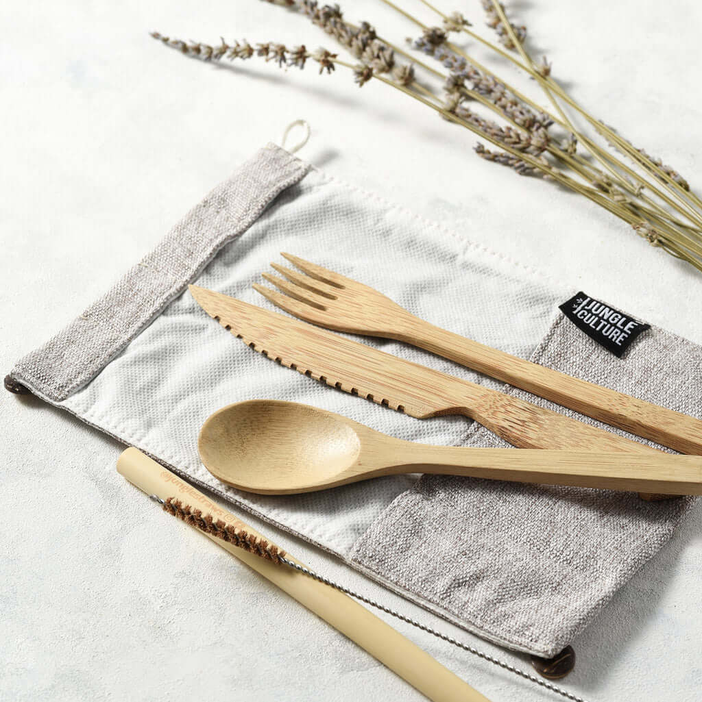 Bamboo cutlery set with spoon, fork, knife, and straw in reusable pouch for van life and outdoor adventures