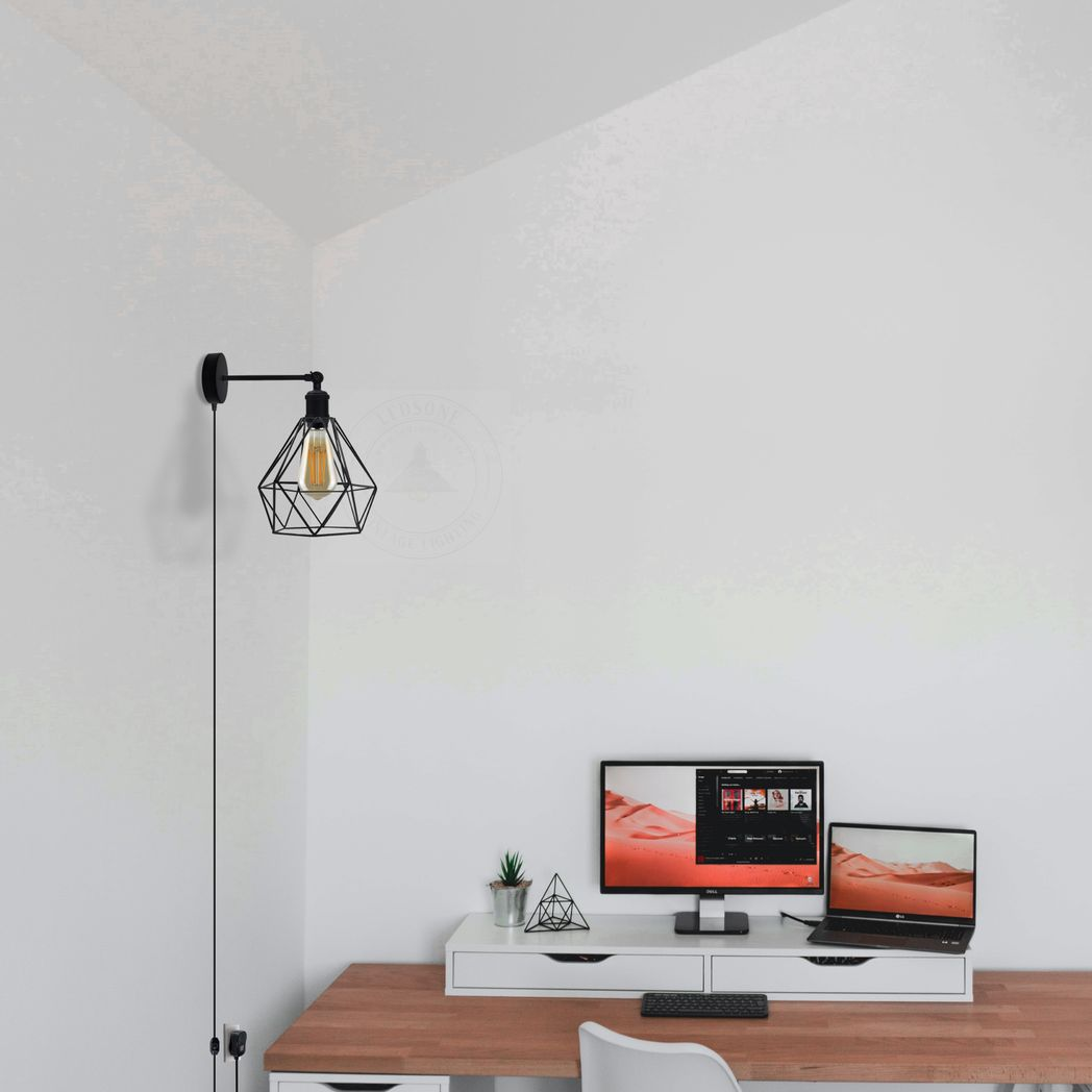 Industrial geometric wall lamp with Edison bulb, perfect for van life or compact home office setups.
