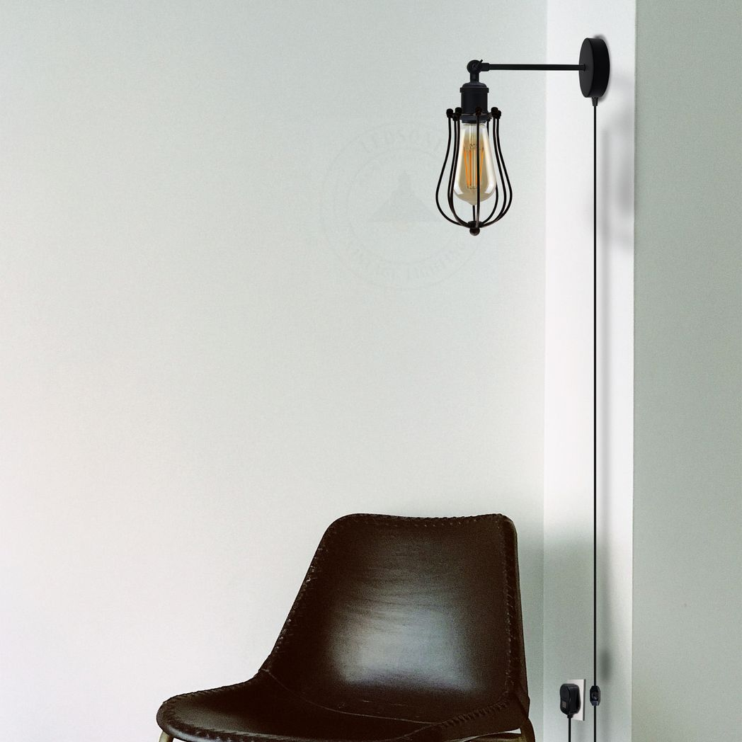 Black industrial wall lamp with Edison bulb, perfect for van life or cozy camper interiors