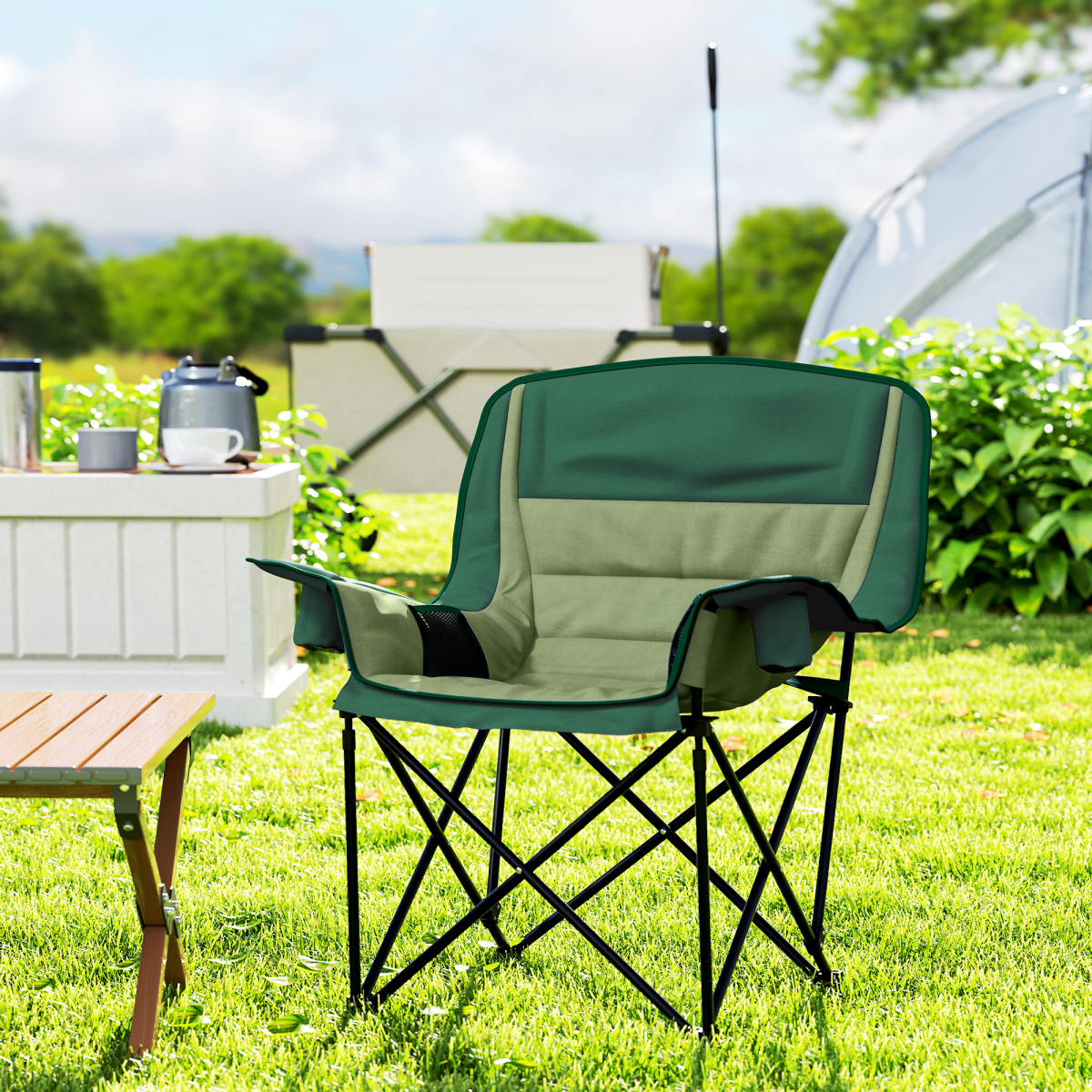 Green and beige camping chair on grass, perfect for van life and outdoor adventures with side table and tent nearby