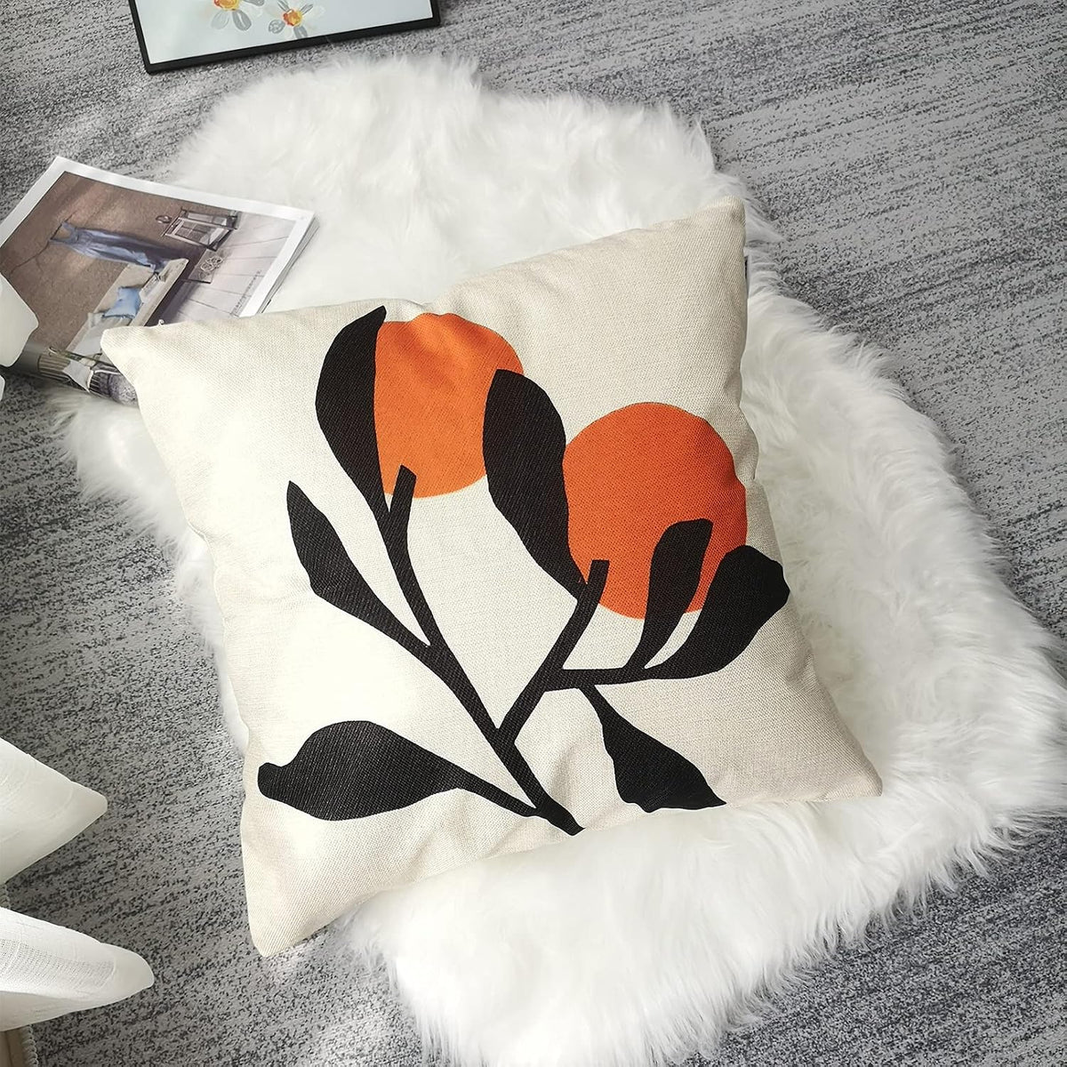 Orange Botanical Cushion Covers – 4 Pack, 50cm – leaf design cushion on a sofa