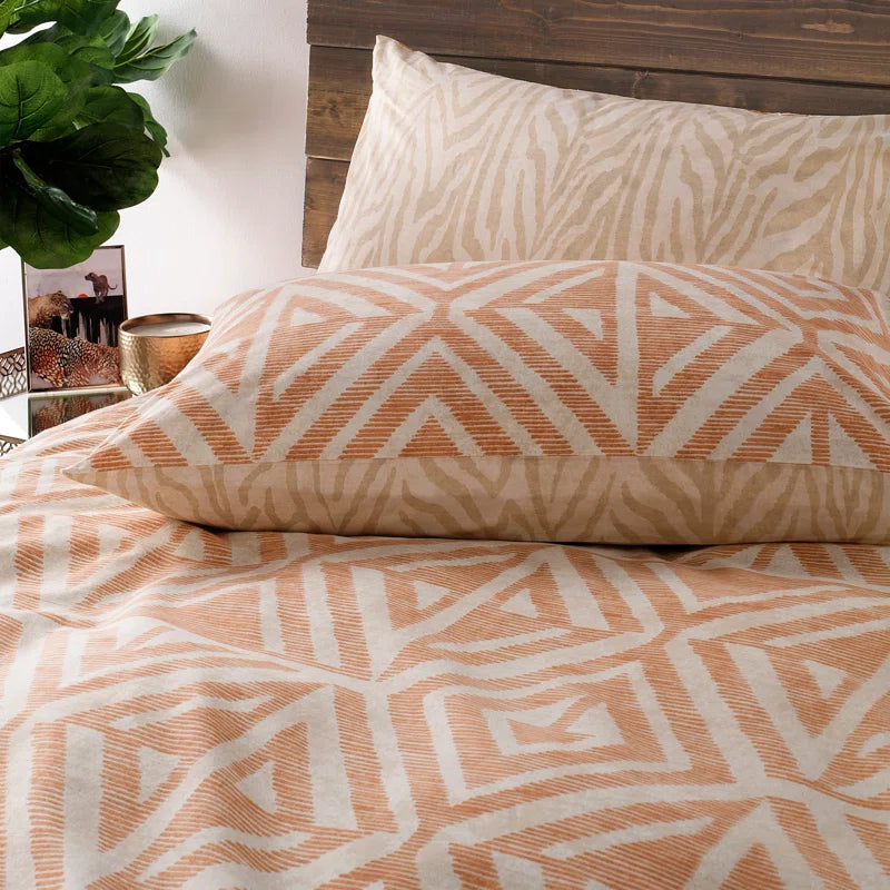Boho geometric print bedding set for van life camper vans, cozy desert aesthetic with warm tones