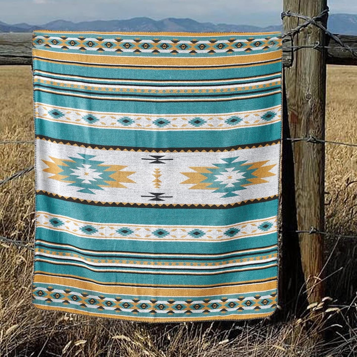 Boho geometric blanket with teal, gold, and white patterns, perfect for van life adventures and outdoor camping.