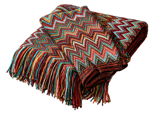 Colorful zigzag patterned throw blanket with fringe, perfect for van life and outdoor adventures