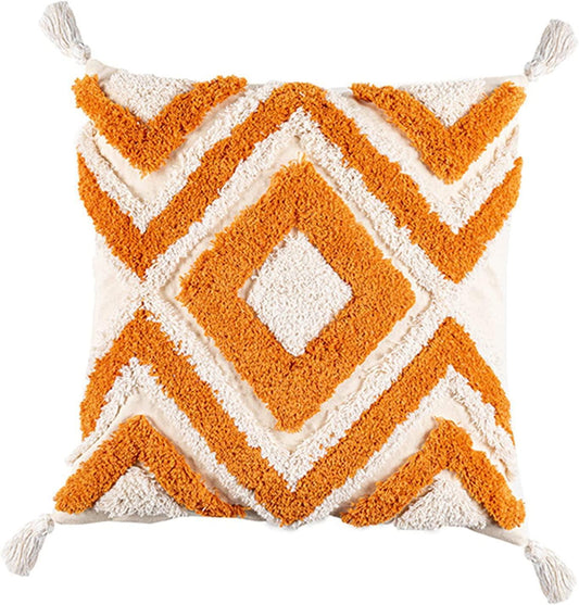 Orange and cream geometric boho pillow with tassels for van life or camper decor