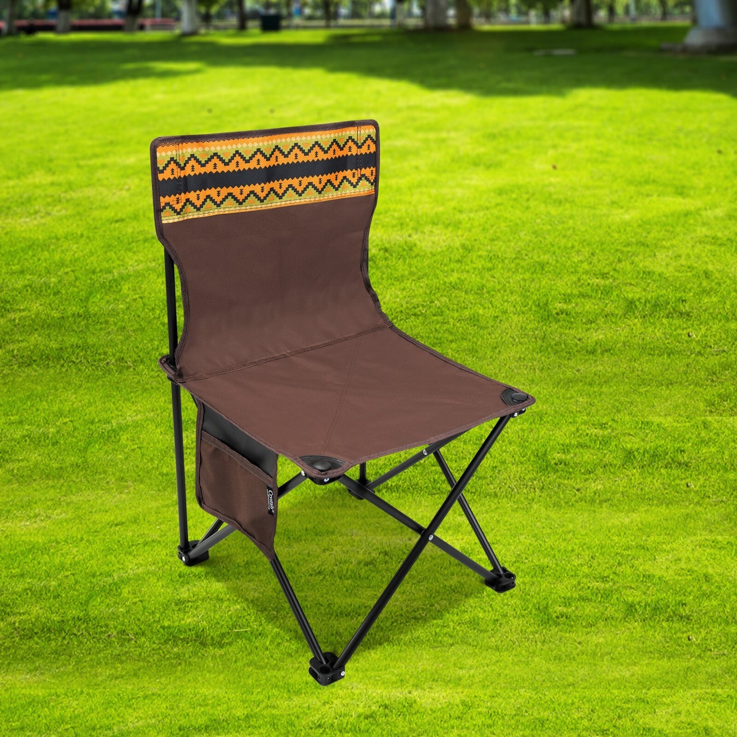 Portable camping chair with patterned back, ideal for van life, festivals, and outdoor adventures on grass.