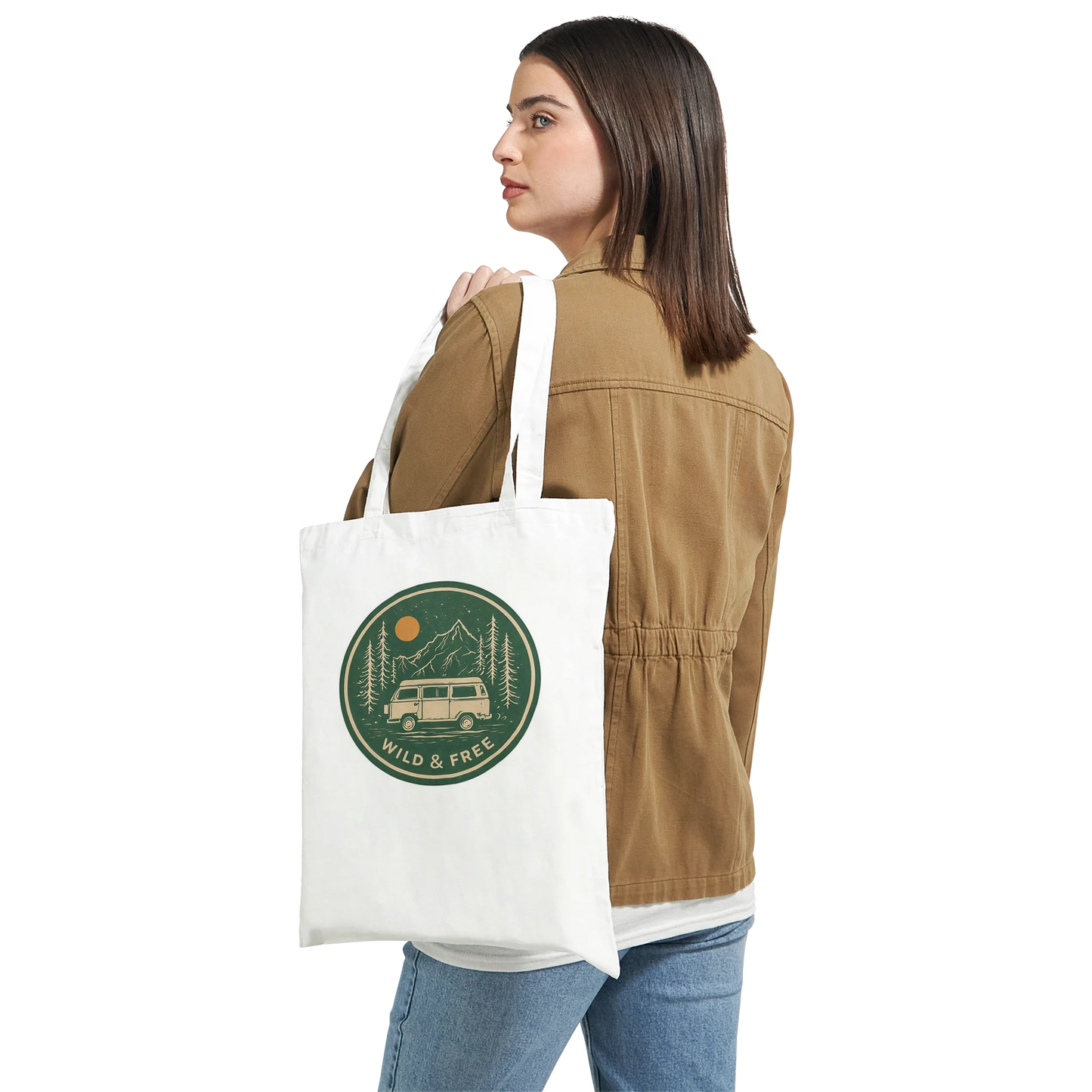 White tote bag with 'Wild & Free' van life design, perfect for outdoor adventures and festival goers.