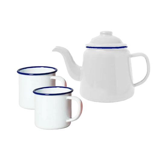 White enamel teapot and mugs with blue rims, perfect for van life camping and outdoor adventures.