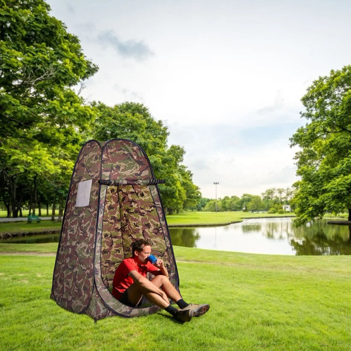 Camouflage pop-up privacy tent for camping, van life, or outdoor adventures near a lake
