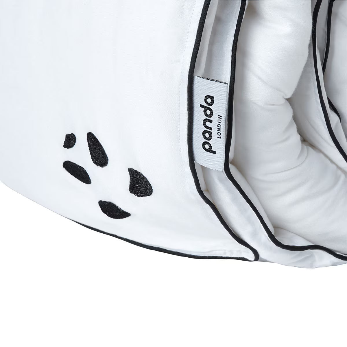 White panda-themed duvet with black paw print design and 'panda LONDON' tag, ideal for van life comfort