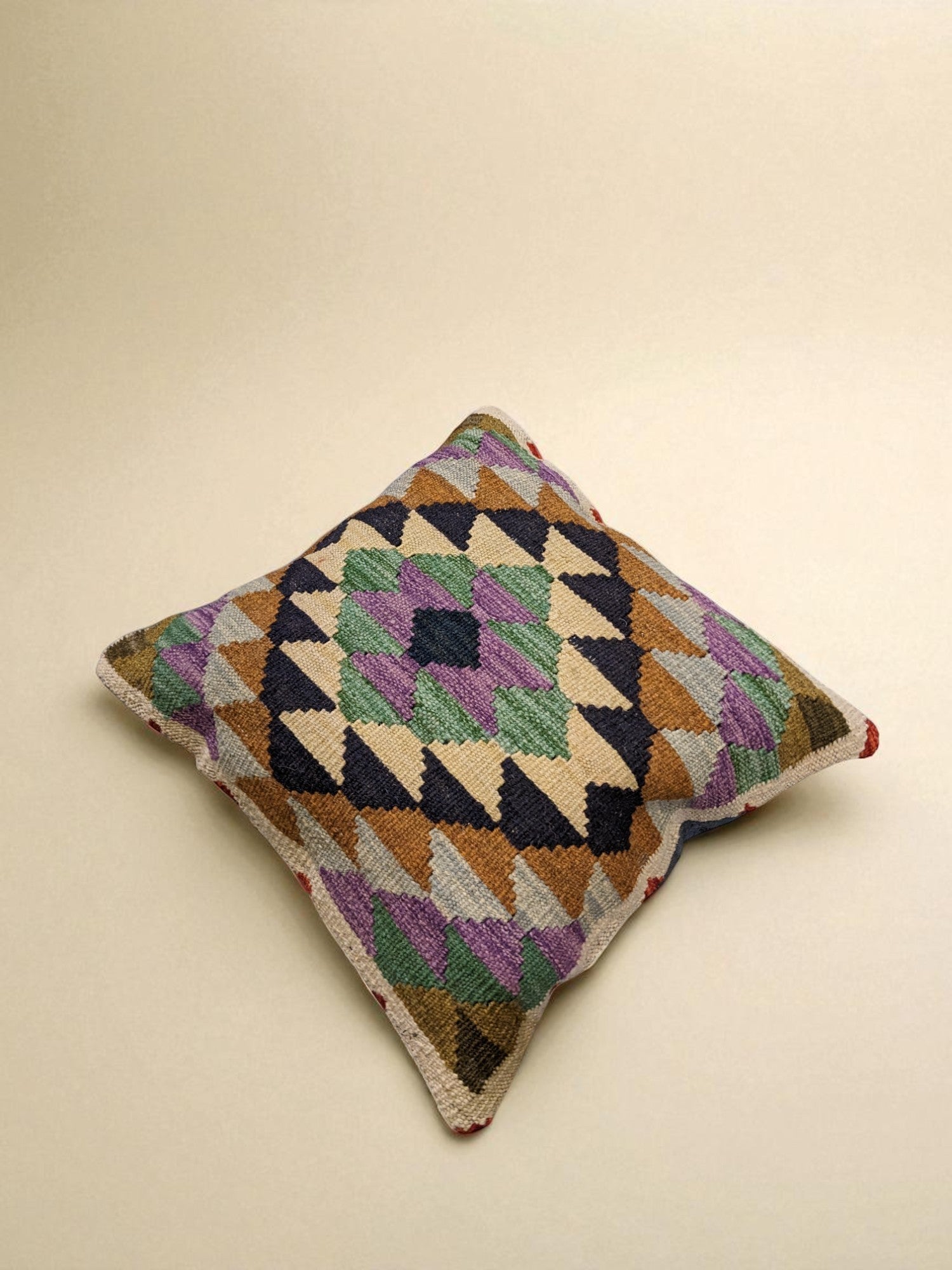 Boho geometric cushion for van life, camper van decor with colorful woven pattern
