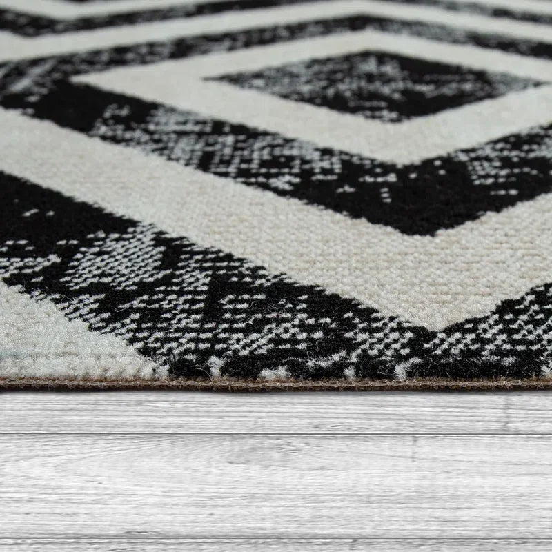Black and white geometric rug for van life, camper van interior, or outdoor adventure gear