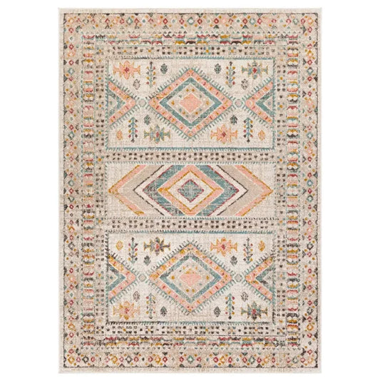 Boho-style area rug with geometric diamond patterns, perfect for van life interiors and cozy camper decor.